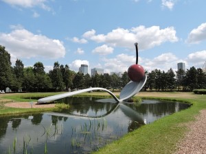 a park in minneapolis with the modern art sculptre of a spoon and cherry