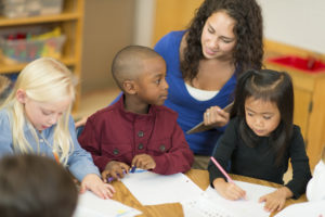 Multi-ethnic group of preschool students in classroom