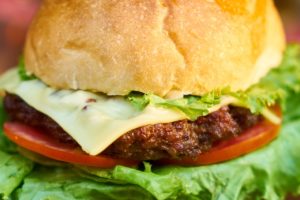 Close-up of a burger with cheese.