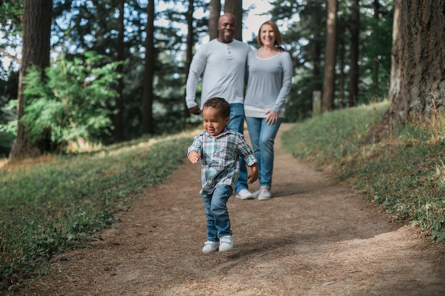 Parents and child walking on trail