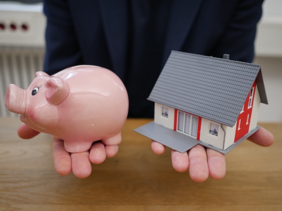 Piggy bank and house figure